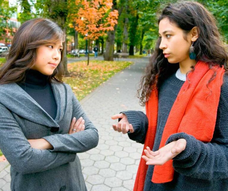 two women arguing at a park
